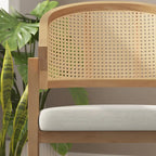Sedia da pranzo in rattan con seduta imbottita e braccioli
